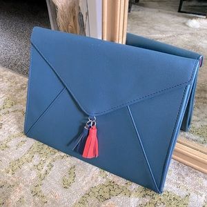 Navy and pink tassel clutch